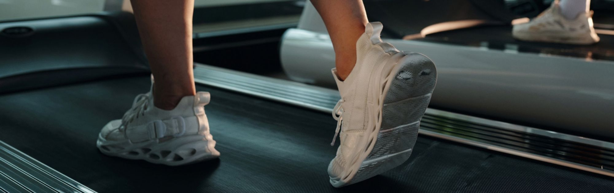 Person walking on a treadmill to support circulation and calf muscle function for varicose vein health.